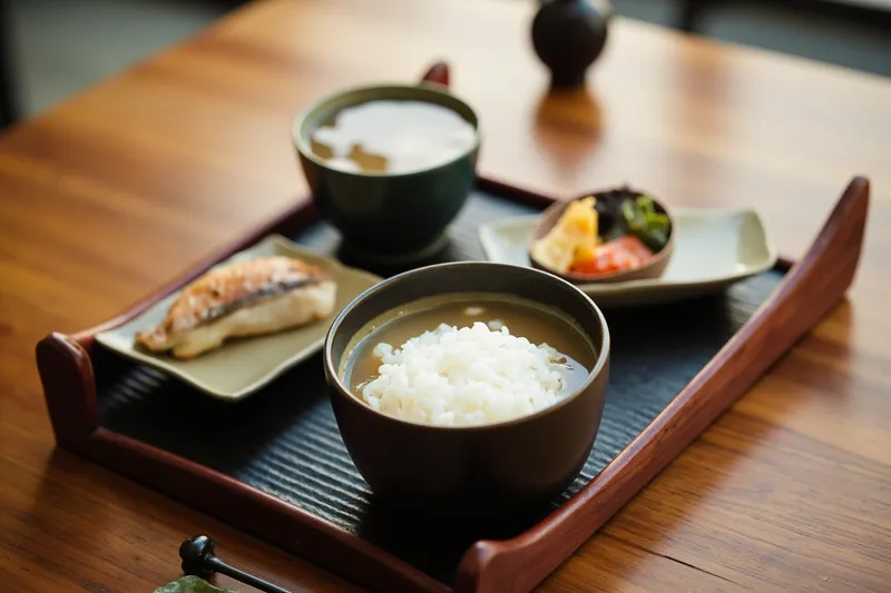 Traditional Japanese teishoku tray with rice, soup and grilled fish