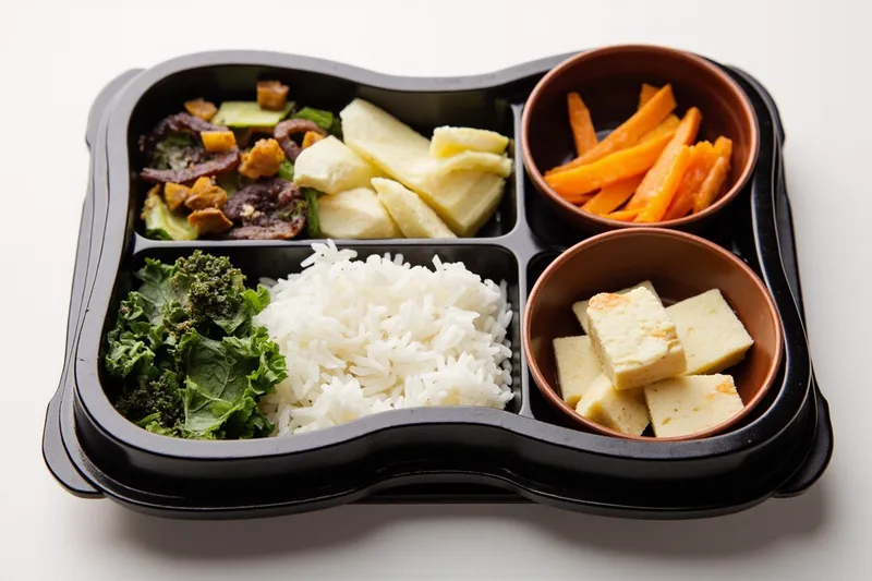 Teishoku tray with rice, vegetables and tofu in separate sections