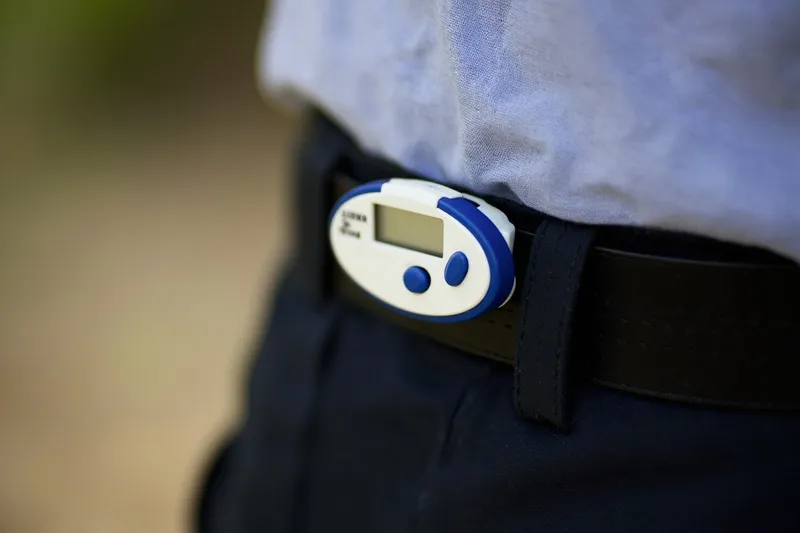 Small motion sensor clipped onto a fabric belt